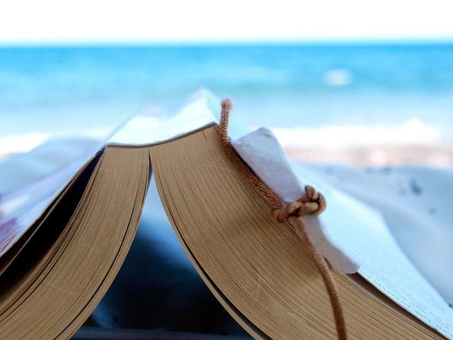 Reading a book at the beach by Simon Cocks summer, reading, list, beach
